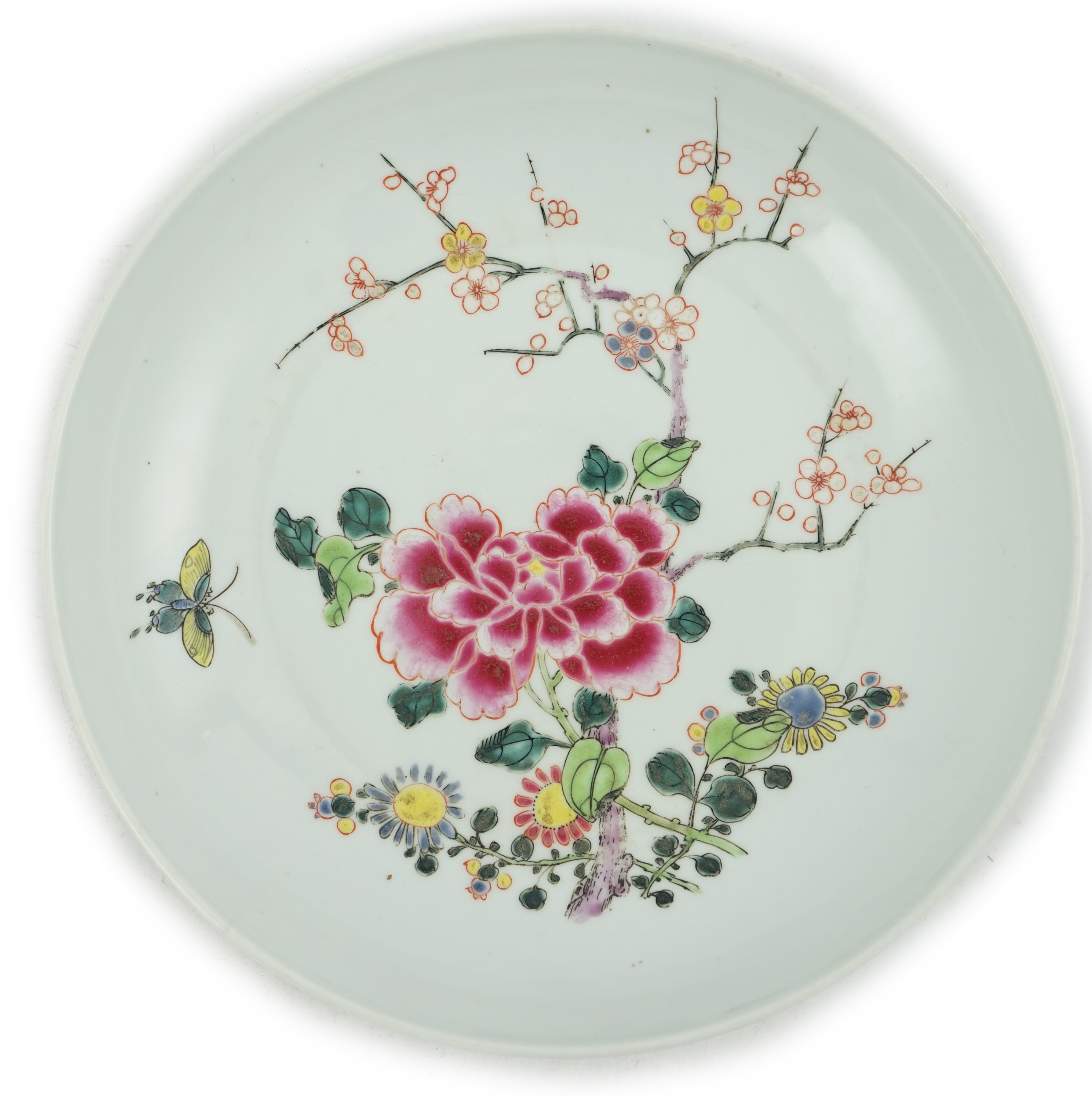 A Chinese famille rose ‘peony and prunus’ saucer dish, Yongzheng mark and period (1723-35)